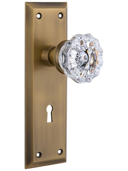 New York Style Doorset with Fluted Crystal Door Knobs in Antique Brass.